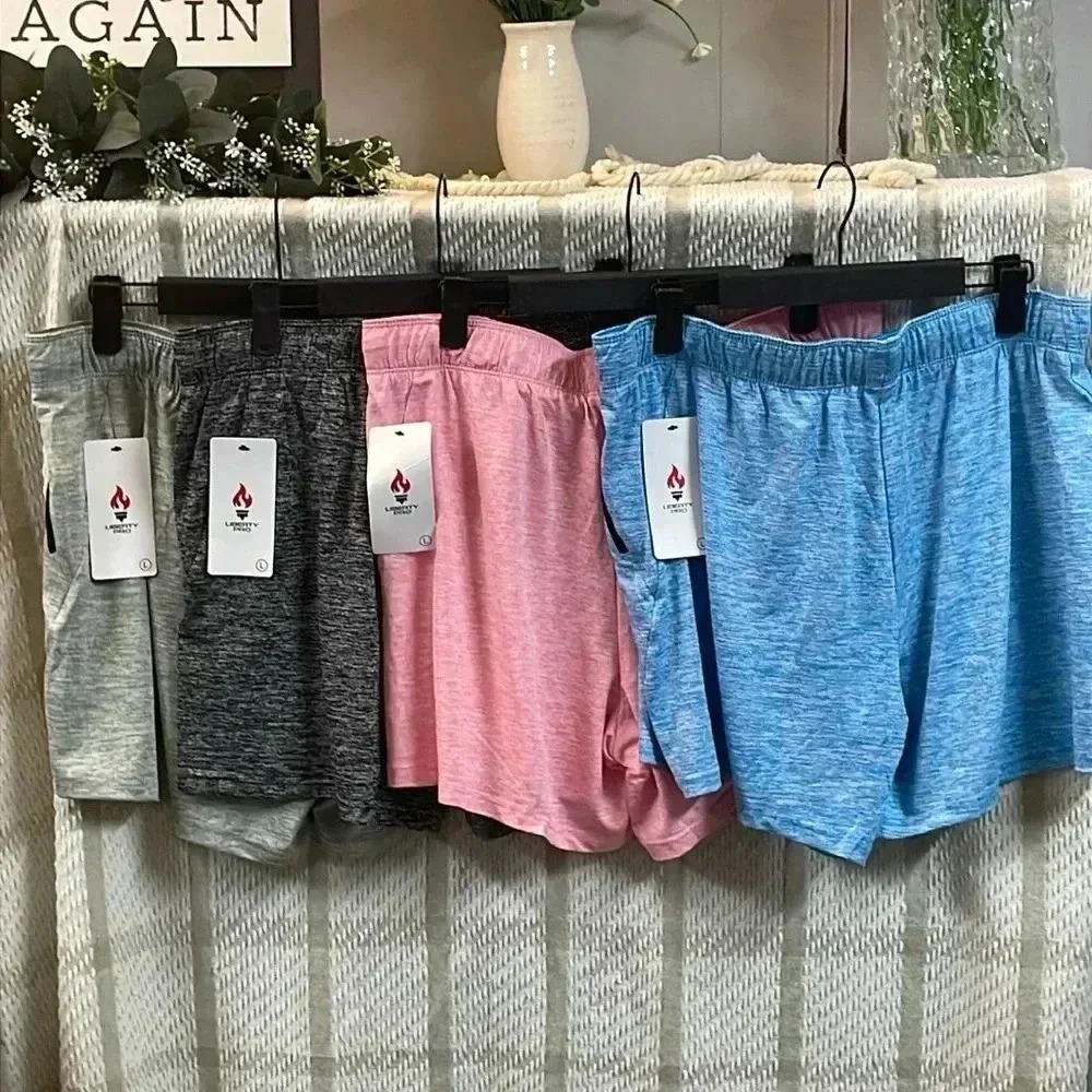 4 pack of Women’s Athletic Shorts NWT size Large - Picture 1 of 8